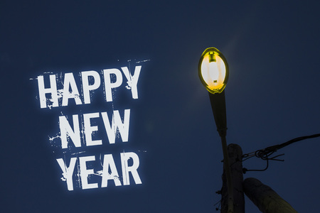 Word writing text Happy New Year. Business concept for congratulations Merry Xmas everyone beginning of January Light post dark blue cloudy clouds sky ideas message enlighten reflectionsの写真素材