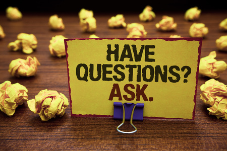 Handwriting text writing Have Questions question Ask.. Concept meaning asking someone respond you with feedback Yellow sticky card clipped text notice crumpled paper balls wood tableの写真素材