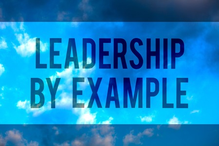 Handwriting text Leadership By Example. Concept meaning Becoming role model for people Have great qualities Multiline text desktop natural blue sky cloudy background send messagesの写真素材