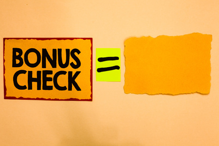Writing note showing Bonus Check. Business photo showcasing something in addition to what is expected or strictly due Orange paper notes reminders equal sign important messages to rememberの写真素材