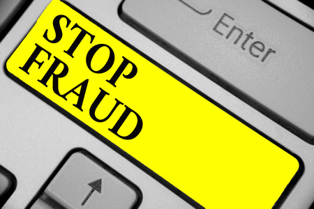 Writing note showing Stop Fraud. Business photo showcasing campaign advices people to watch out thier money transactions Keyboard yellow key Intention computer computing reflection documentの写真素材