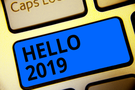 Writing note showing Hello 2019. Business photo showcasing Hoping for a greatness to happen for the coming new year Keyboard blue key Intention computer computing reflection documentの写真素材