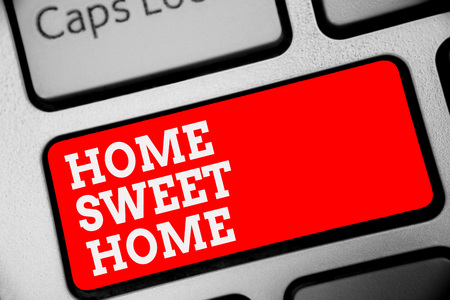 Word writing text Home Sweet Home. Business concept for In house finally Comfortable feeling Relaxed Family time Keyboard red key Intention create computer computing reflection documentの写真素材