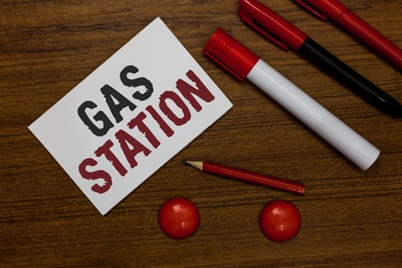 Writing note showing Gas Station. Business photo showcasing for servicing motor vehicles especially with gasoline and oil White paper markers wooden background communicating ideas messagesの写真素材
