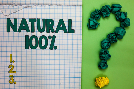Writing note showing Natural 100. Business photo showcasing Minimally processed and does not contain artificial flavors Square notebook crumpled papers forming question mark green backgroundの写真素材