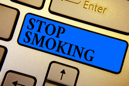 Conceptual hand writing showing Stop Smoking. Business photo text Discontinuing or stopping the use of tobacco addiction Keyboard blue key create computer computing reflection documentの写真素材