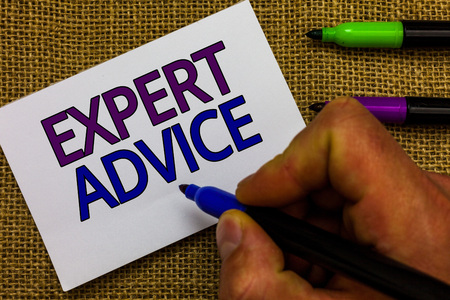 Text sign showing Expert Advice. Conceptual photo Sage Good Word Professional opinion Extensive skill Ace Man hand holding marker white paper communicating ideas Jute backgroundの写真素材