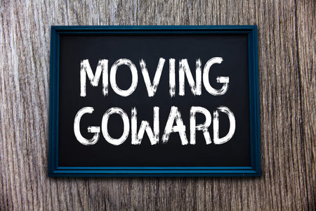 Handwriting text Moving Goward. Concept meaning Towards a Point Move on Going Ahead Further Advance...