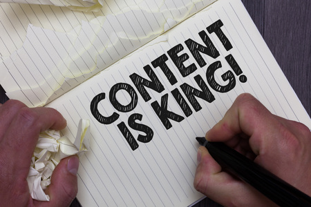 Text sign showing Content Is King. Conceptual photo words what sells products and provide good marketing Man holding marker notebook crumpled papers ripped pages mistakes madeの写真素材