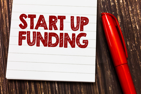 Conceptual hand writing showing Start Up Funding. Business photo showcasing begin to invest money in newly created company or campaign.の写真素材