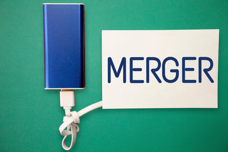 Word writing text Merger. Business concept for combination of two things especially companies flats...