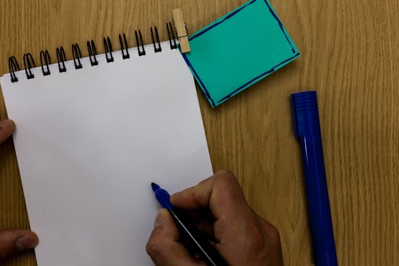 Design business Empty copy space text for Ad website promotion isolated Banner template. Man holding marker notebook clothespin reminder wooden table cup coffeeの写真素材