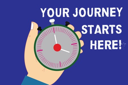 Writing note showing Your Journey Starts Here. Business photo showcasing Motivation for starting a business Inspiration Hu analysis Hand Holding Stop Watch Timer with Start Stop Buttonの写真素材