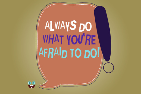 Writing note showing Always Do What You Re Afraid To Do. Business photo showcasing Overcome your fear Challenge motivation Blank Color Speech Bubble Outlined with Exclamation Pointの写真素材