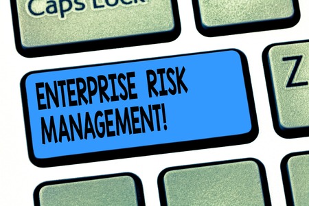 Word writing text Enterprise Risk Management. Business concept for analysisage risks and seize business opportunities Keyboard key Intention to create computer message pressing keypad ideaの写真素材