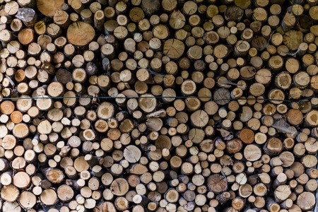 ends of logs wooden background. toning. wood in the stack. - Imageの写真素材