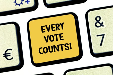 Conceptual hand writing showing Every Vote Counts. Business photo showcasing formal indication choice between two candidates or courses Keyboard key Intention to create computer message ideaの写真素材