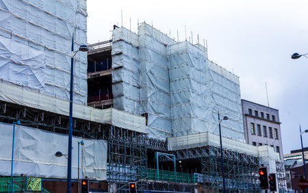 BIRMINGHAM, UK - March 2018 Building Construction Covered with White Cloth for Protection....