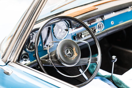 BIRMINGHAM, UK - March 2018 Steel Plated Steering Wheel with Logo Symbol and Dashboard of Vintage...