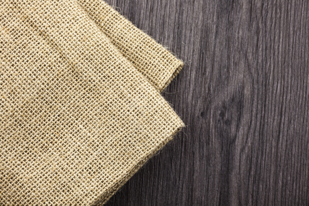 Wooden background with copy space and dishcloth on the topの写真素材