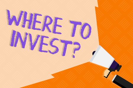 Conceptual hand writing showing Where To Invest Question. Concept meaning asking about where put money into financial schemes or shares Hand Holding Megaphone with Wide Beam Extending the Volumeの写真素材