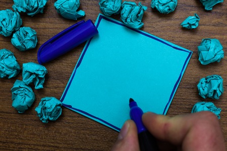 Design business Empty copy space text for Ad website promotion isolated Banner template. Blue paper note reminder crumpled papers marker several tries wooden tableの写真素材