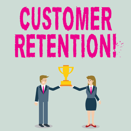 Word writing text Customer Retention. Business photo showcasing Actions or activities companies take to retain customers Man and Woman in Business Suit Holding Together the Championship Trophy Cupの写真素材