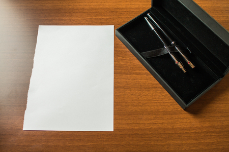 Top view blank stationary paper lying wooden table case ball point set Business Empty template for Layout for invitation greeting card promotion poster voucherの写真素材