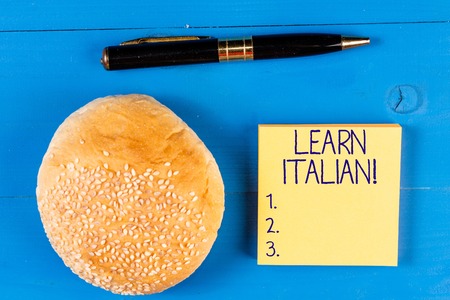 Handwriting text Learn Italian. Conceptual photo gain or acquire knowledge of speaking and writing Italianの写真素材