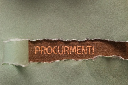 Word writing text Procurment. Business photo showcasing action of acquiring military equipment and supplies Long hole sheet blank paper wrapped paper tear. Wooden table backgroundの写真素材