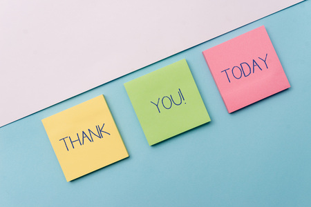 Text sign showing Thank You. Business photo showcasing polite expression used when acknowledging gift service compliment Pastel colour note papers placed sideways on the of softhued backdropの写真素材