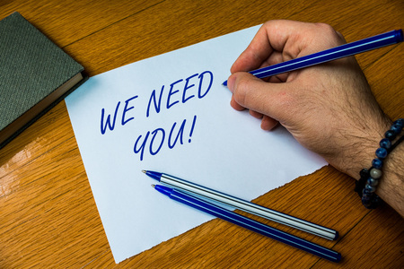 Handwriting text writing We Need You. Conceptual photo asking someone to work together for certain job or target Top vie male handwriting wooden desk electronic device Writing down projectの写真素材