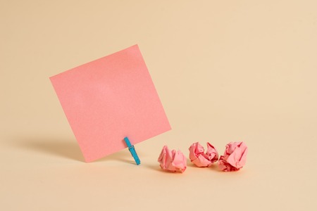 Plain note paper and stationary placed above soft pastel colour backdropの写真素材