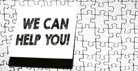 Word writing text We Can Help You. Business photo showcasing offering good assistance to customers or friends Piece of square note paper use for give notation stick to puzzle backgroundの写真素材