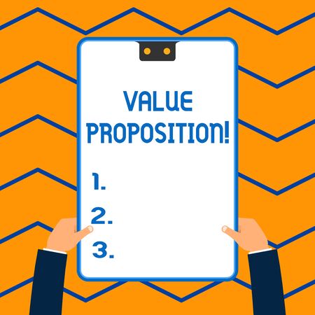Word writing text Value Proposition. Business photo showcasing service make company or product attractive to customers White rectangle clipboard with blue frame has two holes holds by handsの写真素材