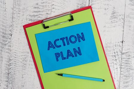 Text sign showing Action Plan. Business photo showcasing proposed strategy or course of actions for certain time Colored clipboard blank paper sheet marker sticky note wooden backgroundの写真素材