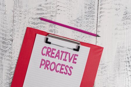 Handwriting text Creative Process. Conceptual photo act of making new connections between old ideas Unique Colored clipboard blank paper sheet pencil old wooden vintage backgroundの写真素材
