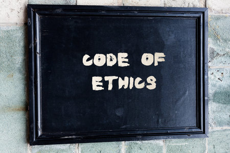Writing note showing Code Of Ethics. Business concept for basic guide for professional conduct and imposes dutiesの写真素材