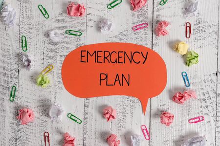 Writing note showing Emergency Plan. Business concept for procedures for handling sudden or unexpected situations Blank speech bubble paper balls clips wooden vintage rustic backgroundの写真素材