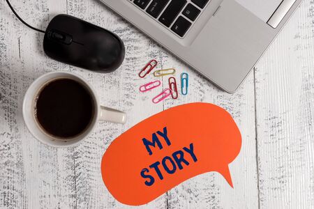 Conceptual hand writing showing My Story. Concept meaning the things or situations that have happened to someone in life Metallic laptop speech bubble coffee cup on vintage tableの写真素材