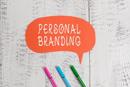 Handwriting text writing Personal Branding. Conceptual photo Practice of People Marketing themselves Image as Brands Ballpoints blank colored speech bubble wooden rustic vintage backgroundの写真素材