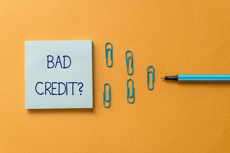 Word writing text Bad Creditquestion. Business photo showcasing inabilityof a demonstrating to repay a debt on time and in full Colored blank sticky note clips binders gathered pen trendy cool backgroundの写真素材