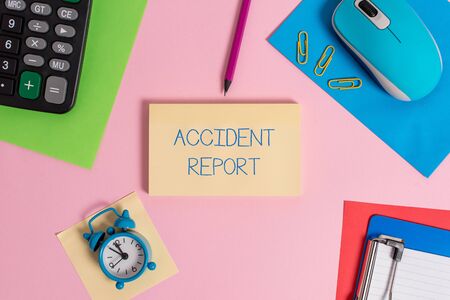 Conceptual hand writing showing Accident Report. Concept meaning A form that is filled out record details of an unusual event Mouse calculator sheets marker clipboard clock color backgroundの写真素材