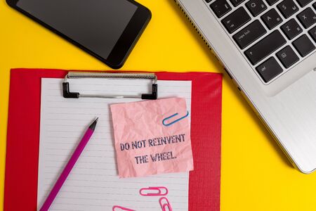 Word writing text Do Not Reinvent The Wheel. Business photo showcasing stop duplicating a basic method previously done Laptop clipboard sheet clips pencil note smartphone colored backgroundの写真素材