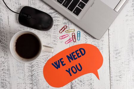 Conceptual hand writing showing We Need You. Concept meaning to fulfill the needs of the assignment duty or obligation Metallic laptop speech bubble coffee cup on vintage tableの写真素材
