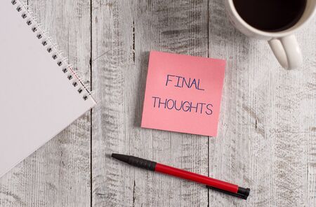 Handwriting text Final Thoughts. Conceptual photo the conclusion or last few sentences within your conclusion Stationary placed next to a cup of black coffee above the wooden tableの写真素材
