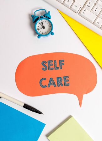 Writing note showing Self Care. Business concept for the practice of taking action to improve one s is own healthの写真素材