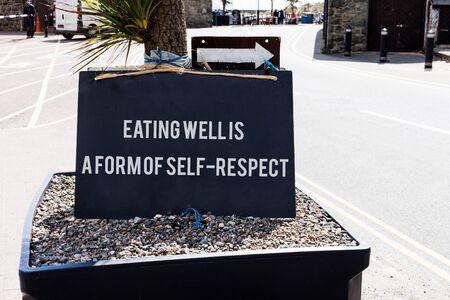 Conceptual hand writing showing Eating Well Is A Form Of Self Respect. Concept meaning a quote of promoting healthy lifestyleの写真素材