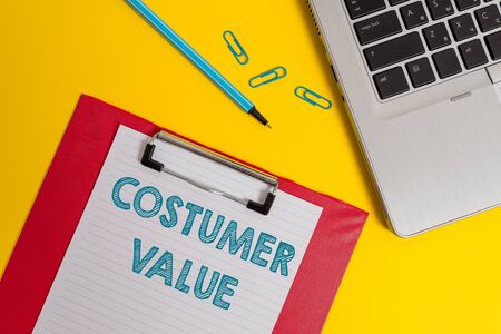 Word writing text Costumer Value. Business photo showcasing Amount of benefits which clients get from purchasing products Open laptop clipboard blank paper sheet marker clips colored backgroundの写真素材