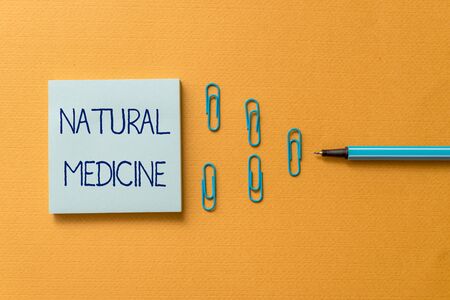 Word writing text Natural Medicine. Business photo showcasing any of various systems of healing or treating disease Colored blank sticky note clips binders gathered pen trendy cool backgroundの写真素材